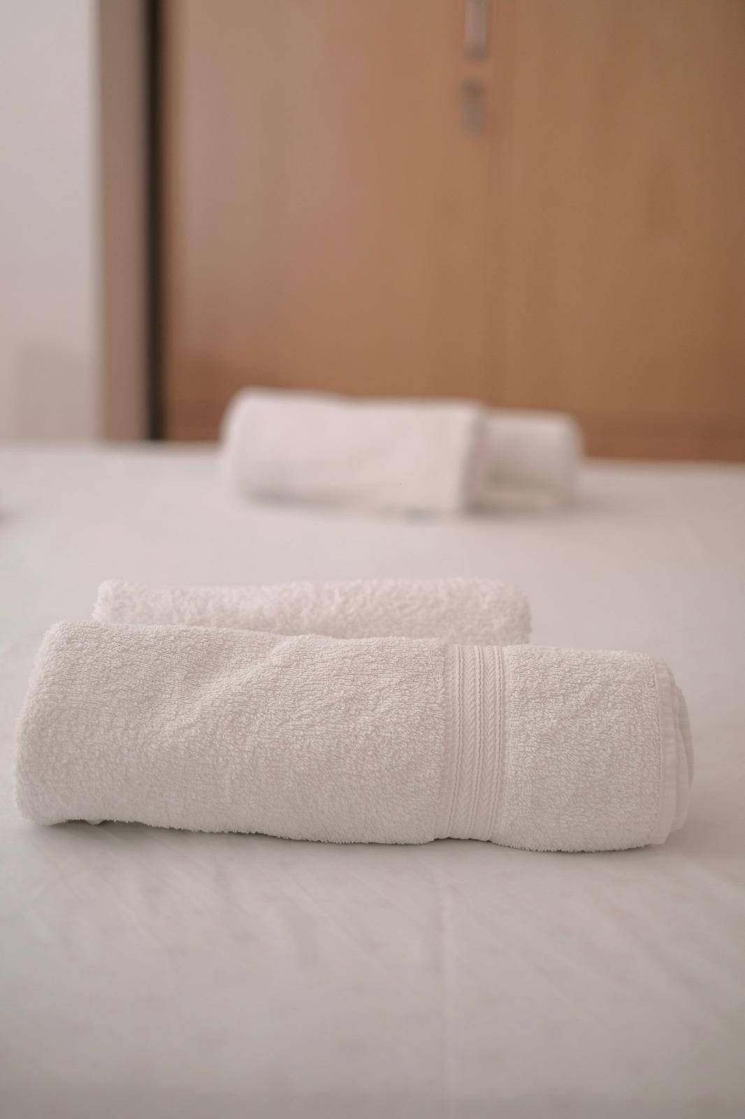 Bed with towels prepared for arrival, holiday rental Vinišće